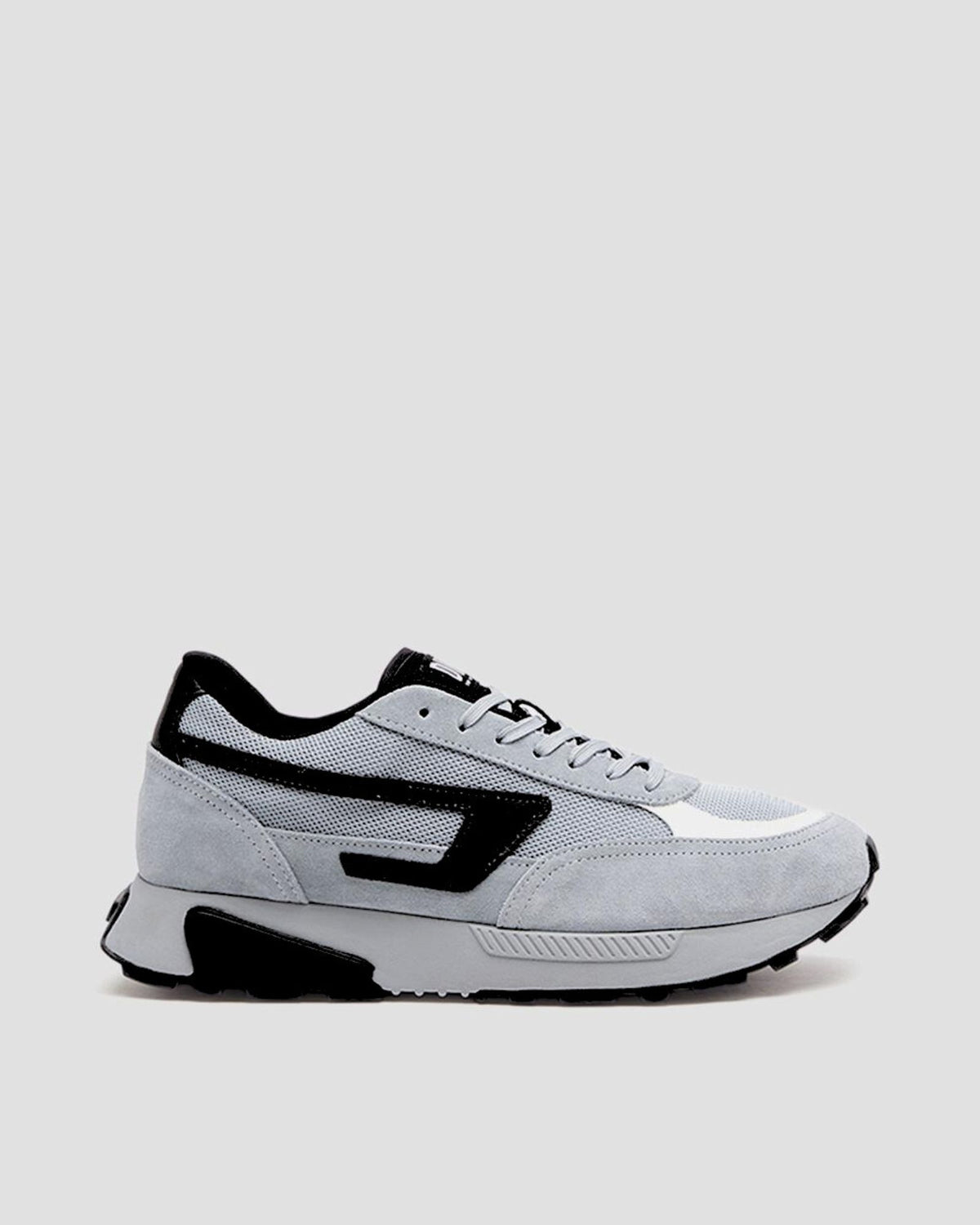 Gray and black sneaker on a light gray background