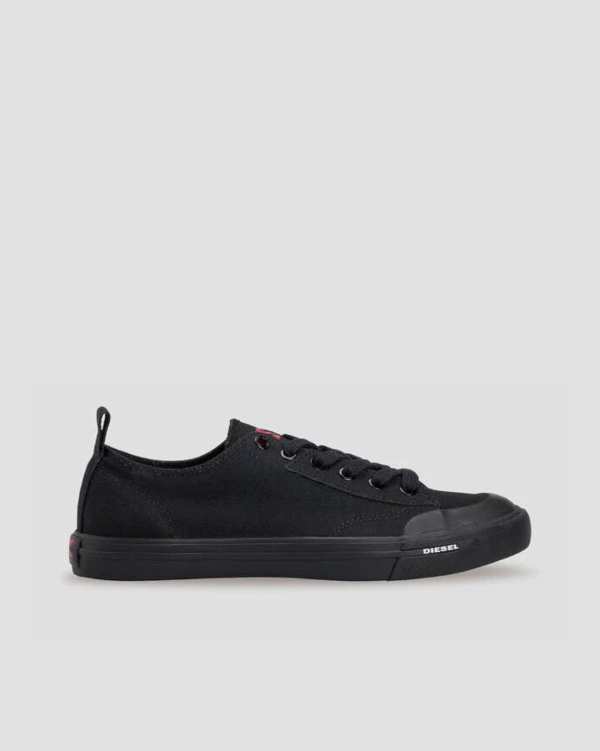 Black sneaker with 'Diesel' branding on a light gray background